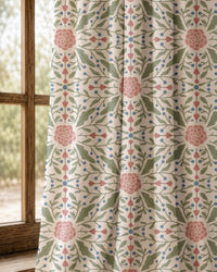 Pair of pink folk medallion curtains at an arched window