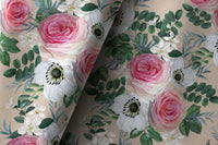 Pair of pink rose floral curtains in a living room