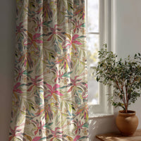 Pink tropical lily curtain beside a potted olive tree