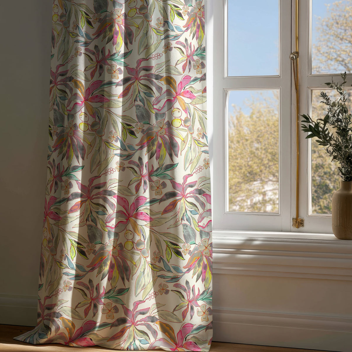 Full-length pink tropical lily curtain draping to a wooden floor