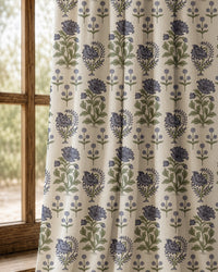 Pair of purple block print floral curtains at an arched window