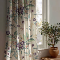 Purple clematis floral curtain beside a potted olive tree