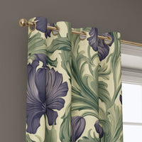 Grommet top of a purple iris william morris style curtain on a brass rod