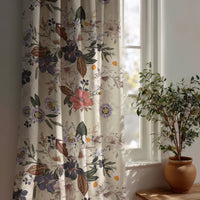 Purple jacobean floral curtain beside a potted olive tree