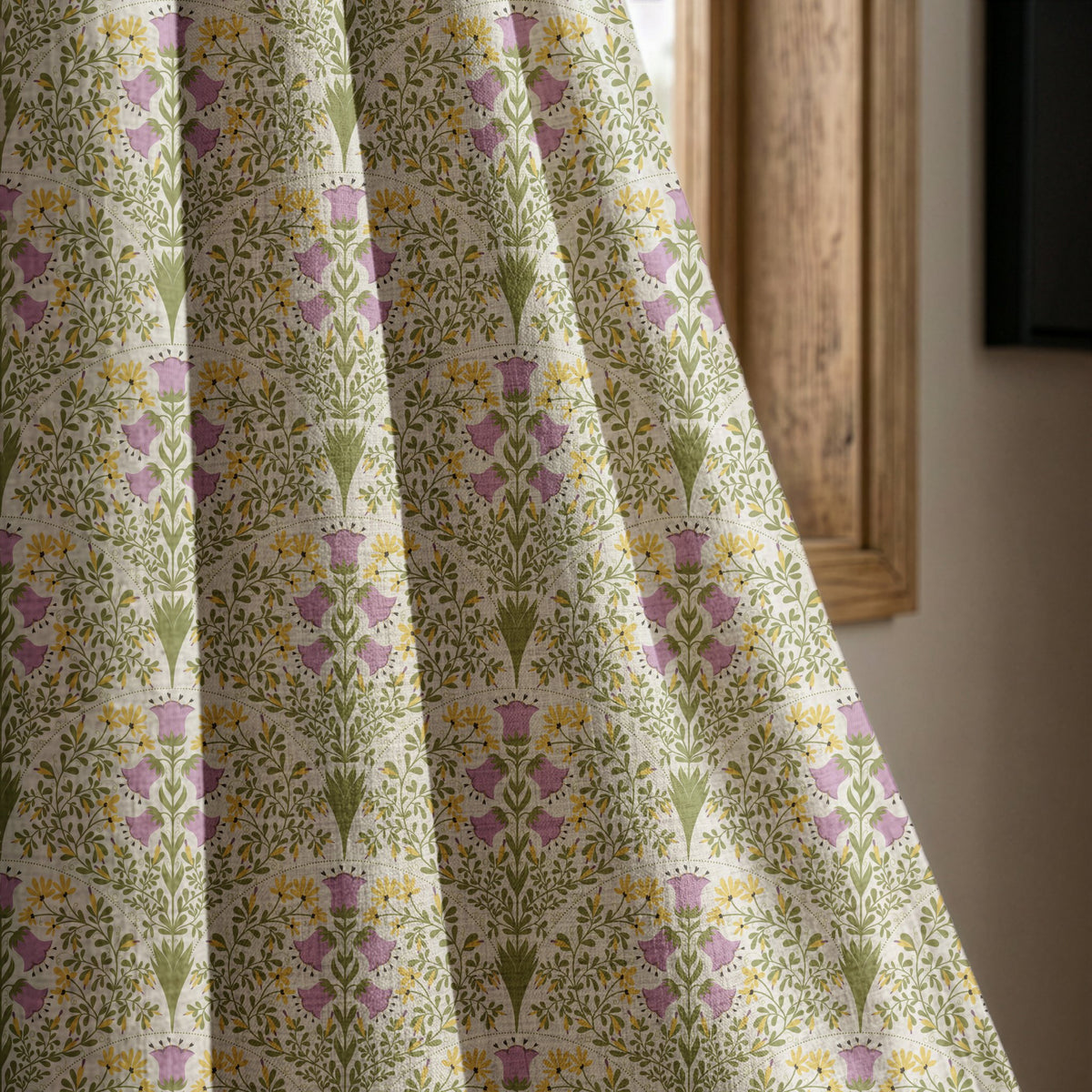 Purple thistle ditsy curtain panel beside a rustic wooden window
