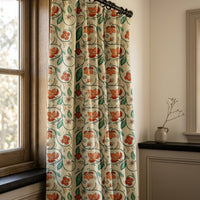 Red floral vine curtains in a warm living room