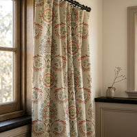 Red and green folk damask curtains in a warm living room