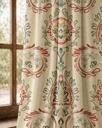 Pair of red and green folk damask curtains at an arched window