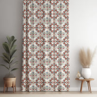 Red medallion tile curtain panel against a white wall