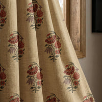 Red poppy block print curtain panel beside a rustic wooden window
