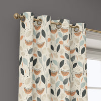 Grommet top of a retro mid century leaf curtain on a brass rod