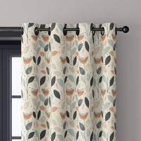 Close-up of retro mid century leaf curtain grommets on a black rod