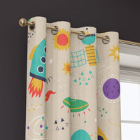 Grommet top of a retro rocket space kids curtain on a brass rod