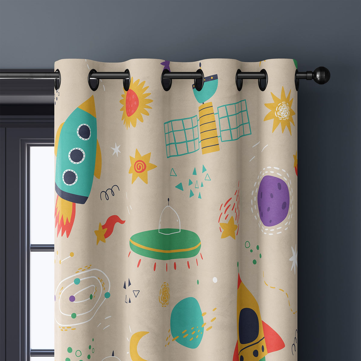 Close-up of retro rocket space kids curtain grommets on a black rod