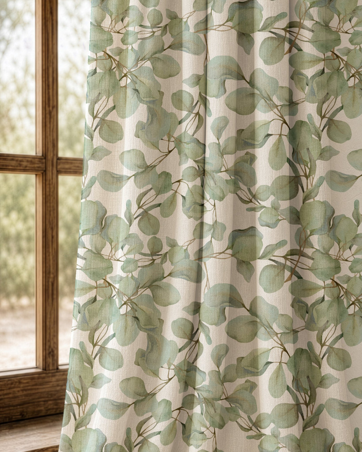 Pair of sage eucalyptus leaf curtains at an arched window