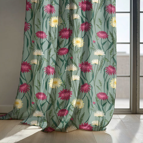 Sage green thistle and daisy curtain panels by a sunny window