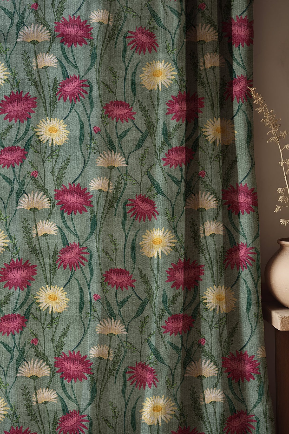 Soft folds of a sage green thistle and daisy curtain