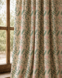 Pair of sage and pink ditsy floral curtains at an arched window