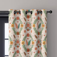 Close-up of scandinavian folk wreath curtain grommets on a black rod