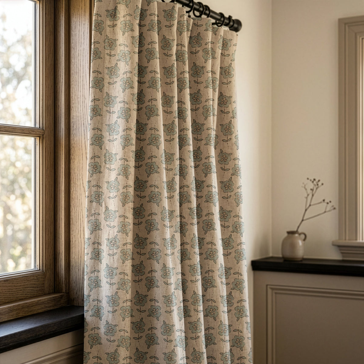 Small blue block print floral curtains in a warm living room