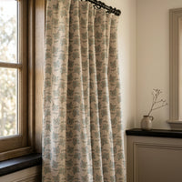 Small blue block print floral curtains in a warm living room