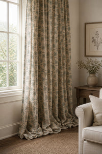 Small blue block print floral curtains in a living room