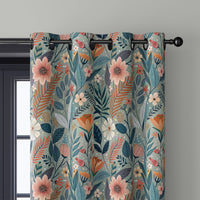 Close-up of teal art nouveau floral curtain grommets on a black rod