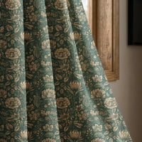 Teal arts and crafts floral curtain panel beside a rustic wooden window