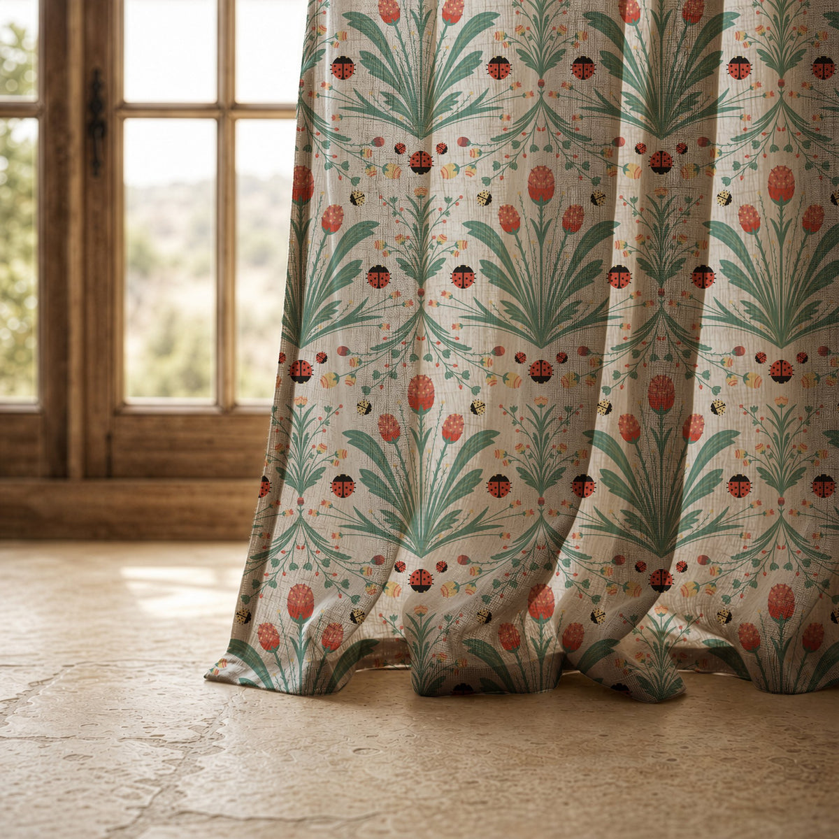 Hem of a teal folk tulip curtain resting on a stone floor