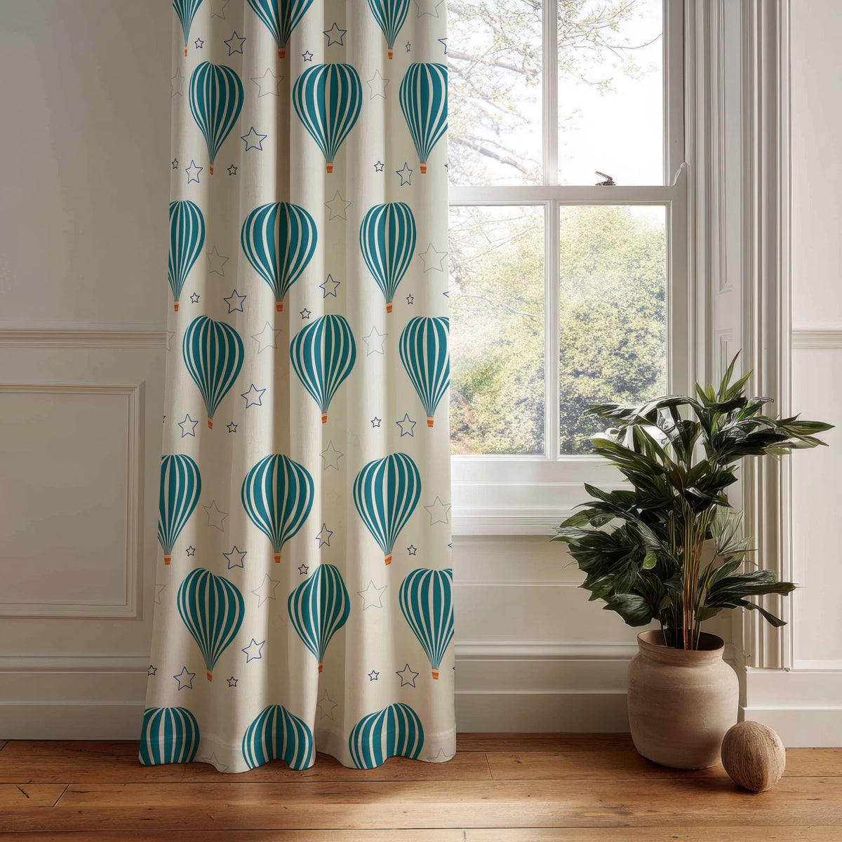 Teal hot air balloon nursery curtain panel hanging by a white window