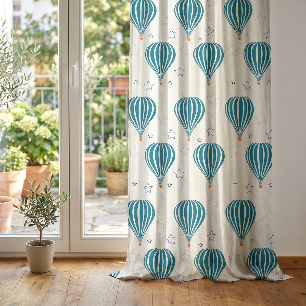 Teal hot air balloon nursery curtain at glass patio doors