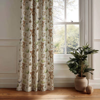 Teddy bear nursery curtain panel hanging by a white window