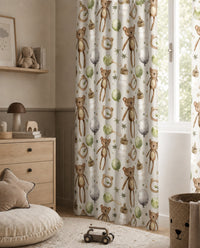 Teddy bear nursery curtains framing a tall window
