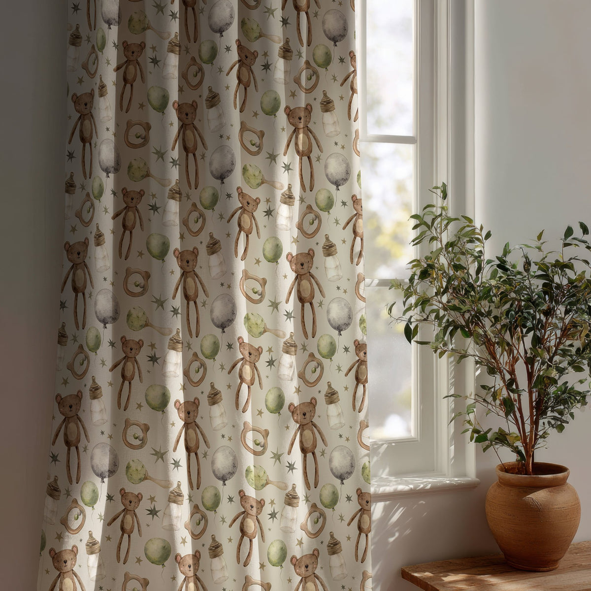 Teddy bear nursery curtain beside a potted olive tree