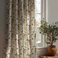 Teddy bear nursery curtain beside a potted olive tree