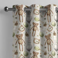 Teddy bear nursery curtain on a grommet rod, close-up of the print