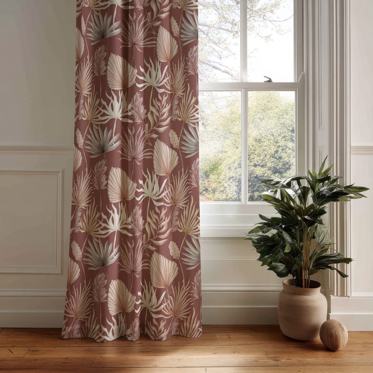 Terracotta palm leaf curtain panel hanging by a white window