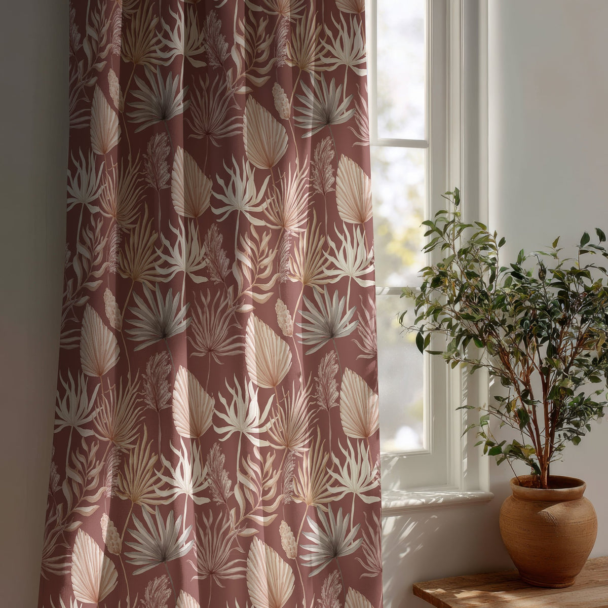 Terracotta palm leaf curtain beside a potted olive tree
