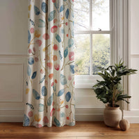 Watercolor leaf and berry curtain panel hanging by a white window
