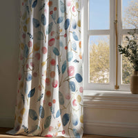 Full-length watercolor leaf and berry curtain draping to a wooden floor