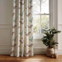 Whale nursery curtain panel hanging by a white window
