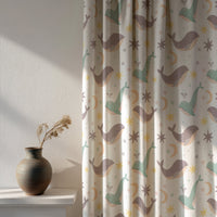 Soft daylight through a whale nursery curtain