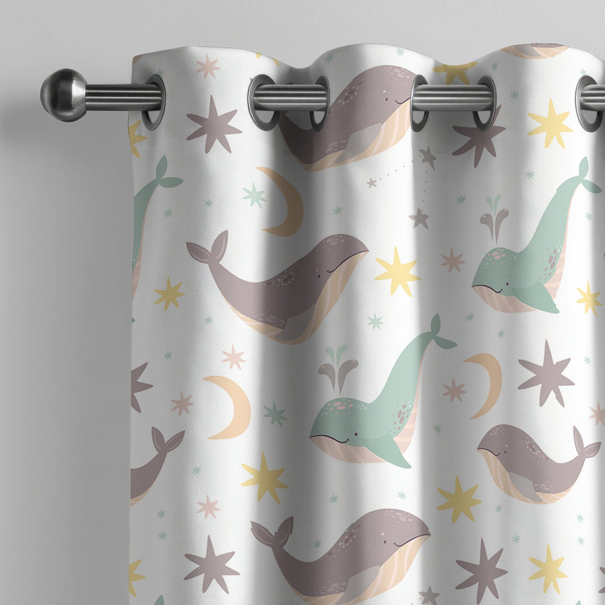 Whale nursery curtain on a grommet rod, close-up of the print