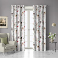 Pair of white minimal wildflower grommet curtains at French doors