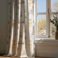 Full-length wooden toy and giraffe nursery curtain draping to a wooden floor