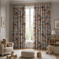 Child peeking out from behind woodland animal curtains