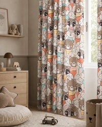 Close-up of fox, raccoon, bear and bunny faces on woodland print fabric