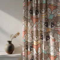 Woodland animal curtain beside a vase on a shelf